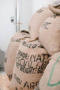  A stack of jute coffee bags full of unroasted coffee